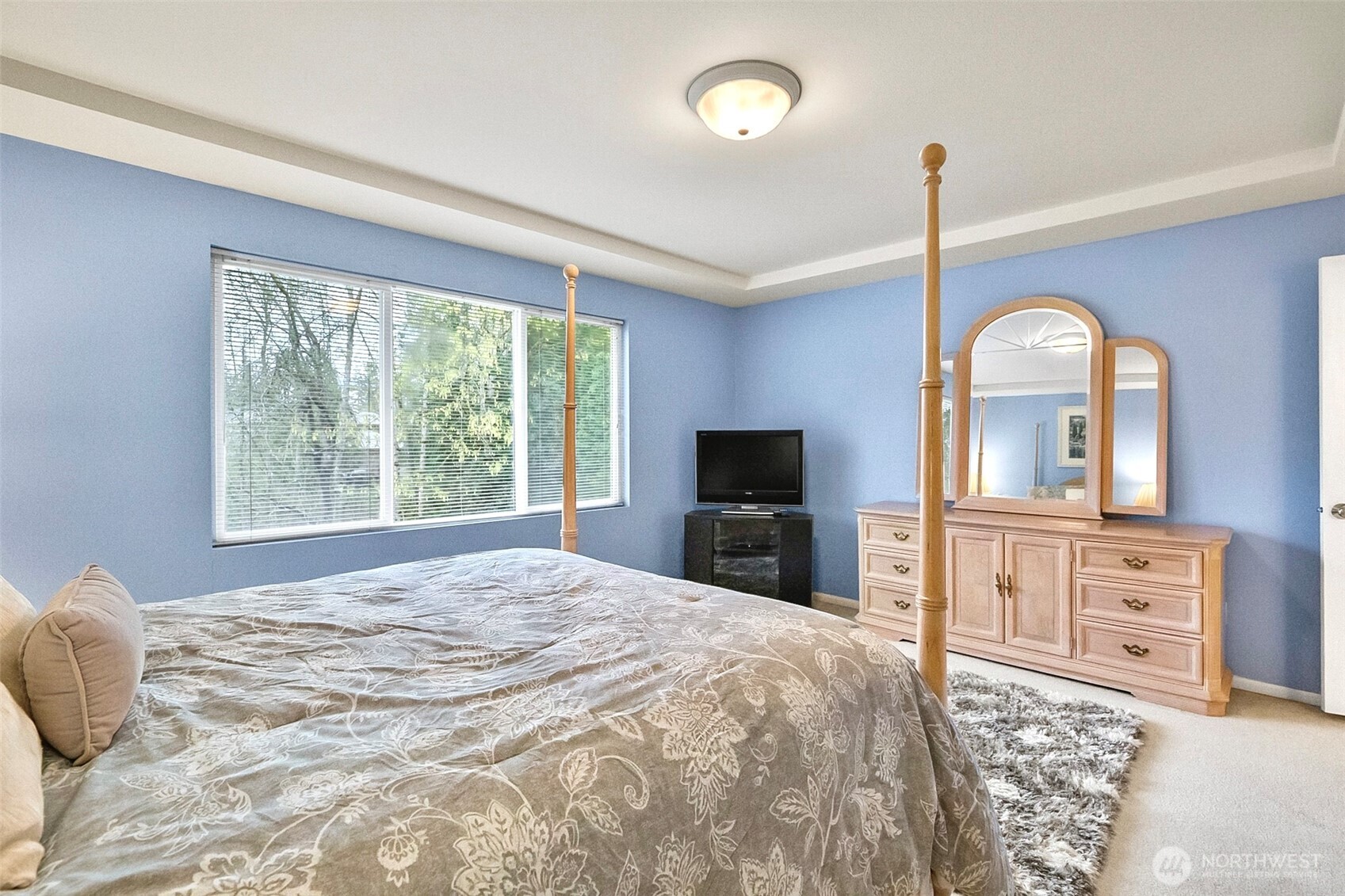 17401 33rd Drive Southeast Bothell, WA 98012 - Photo 25 of 39 a bedroom with a bed dresser and a flat tv screen