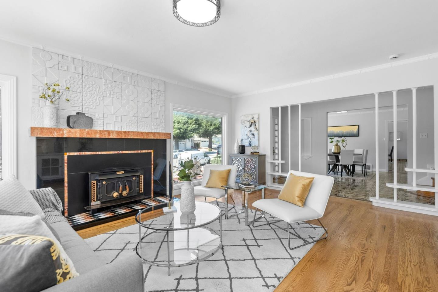 604 Geraldine Drive Millbrae, CA 94030 - Photo 6 of 33 a living room with furniture and a fireplace