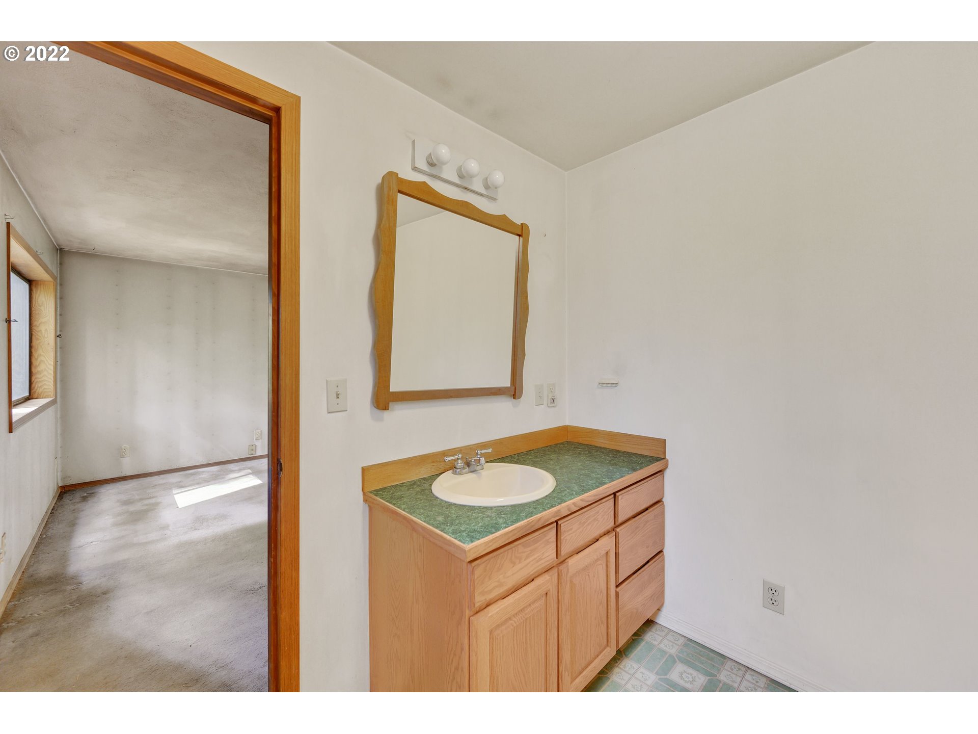 30665 South Partridge Road Colton, OR 97017 - Photo 11 of 20 a bathroom with a granite countertop sink and a mirror