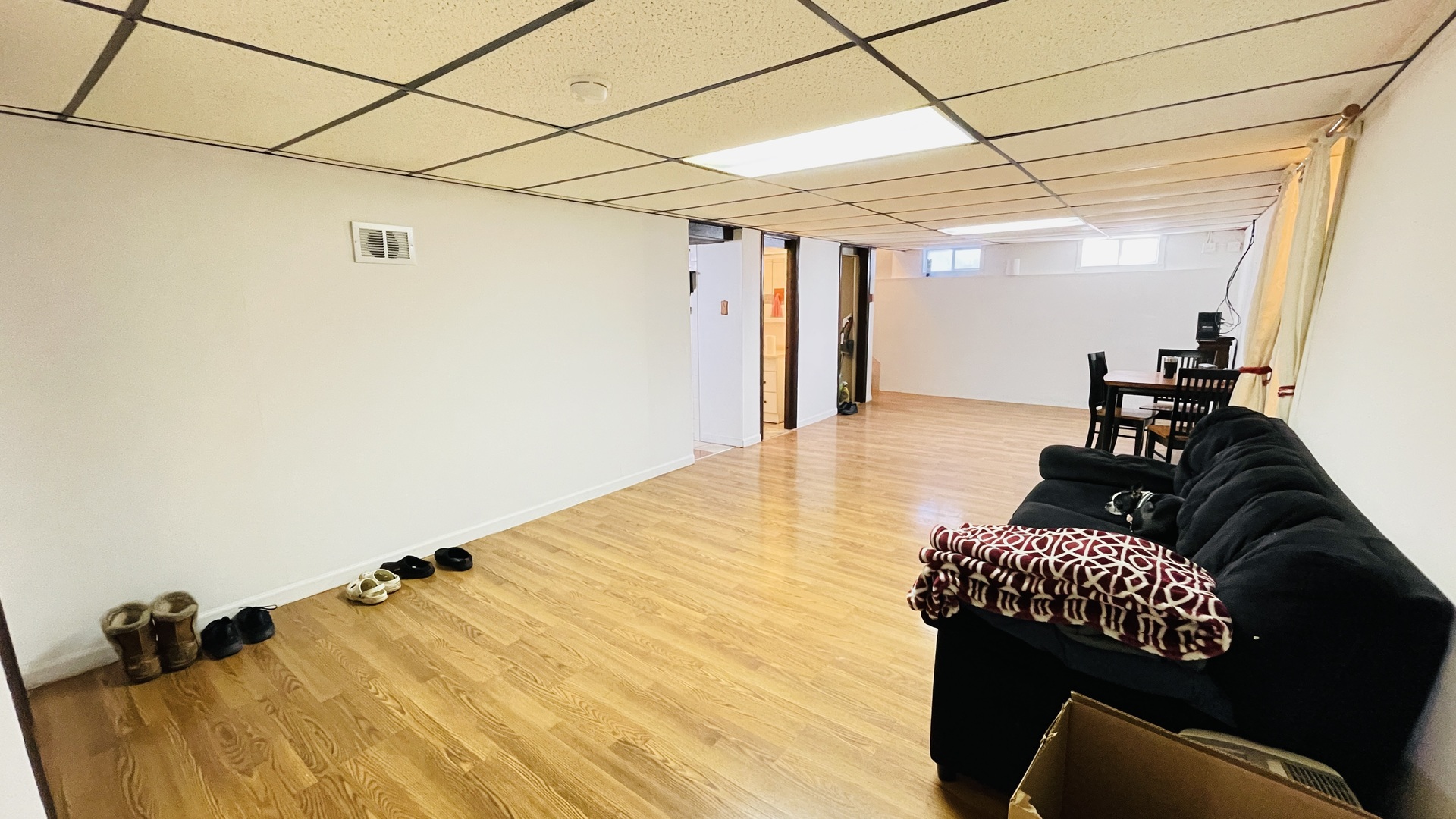 Undisclosed Address Addison, IL 60101 - Photo 15 of 26 a living room with a couch and wooden floor