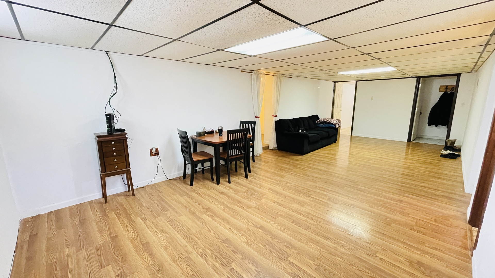 Undisclosed Address Addison, IL 60101 - Photo 16 of 26 a room with furniture and a wooden floor