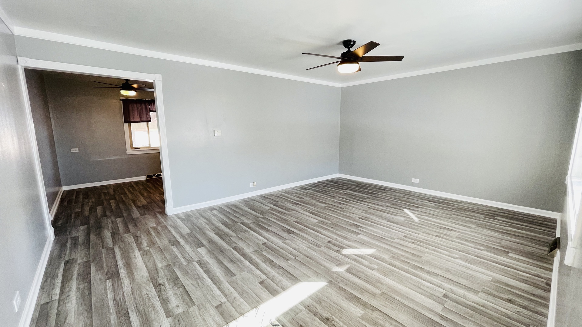 Undisclosed Address Addison, IL 60101 - Photo 2 of 26 a view of empty room with wooden floor