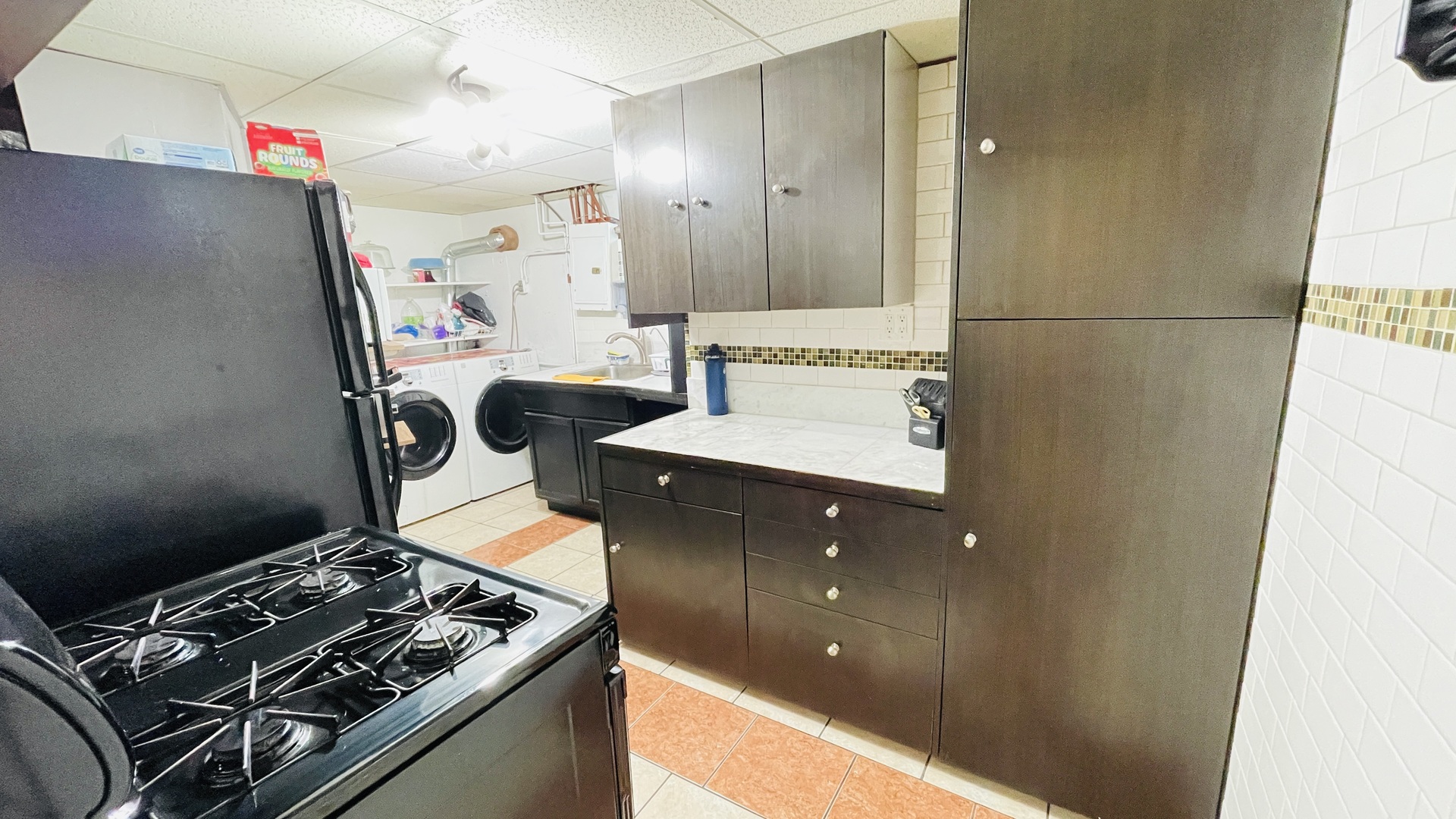 Undisclosed Address Addison, IL 60101 - Photo 21 of 26 a kitchen with a stove and a refrigerator