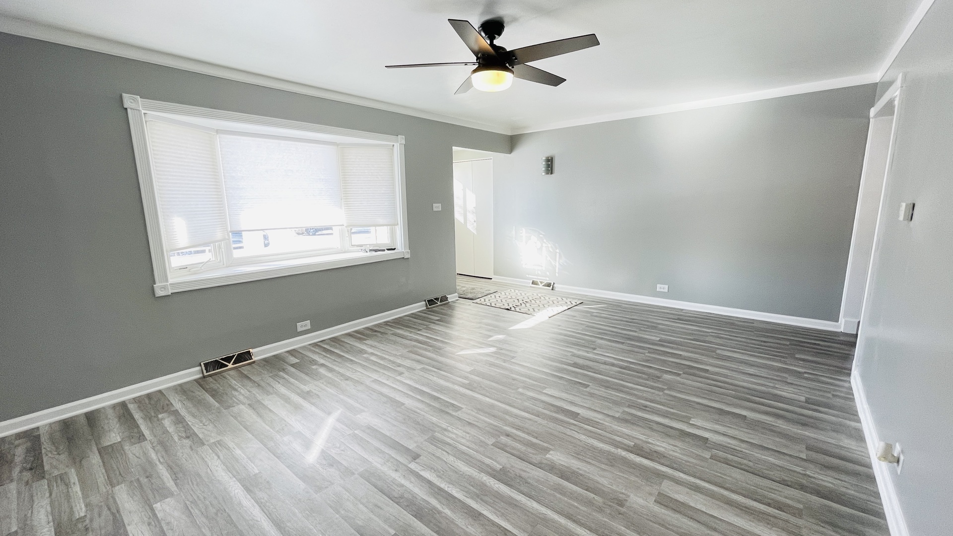 Undisclosed Address Addison, IL 60101 - Photo 3 of 26 wooden floor in an empty room with a window
