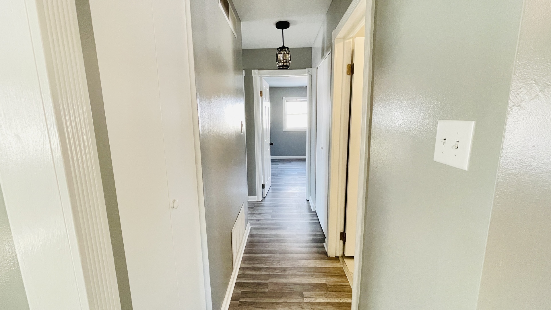 Undisclosed Address Addison, IL 60101 - Photo 7 of 26 a view of a hallway with wooden floor