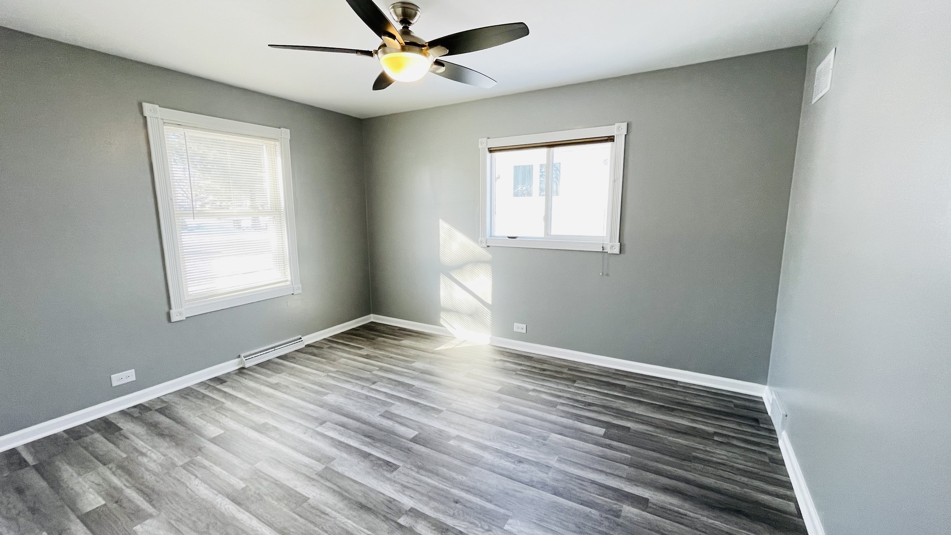 Undisclosed Address Addison, IL 60101 - Photo 8 of 26 a view of an empty room with window and wooden floor