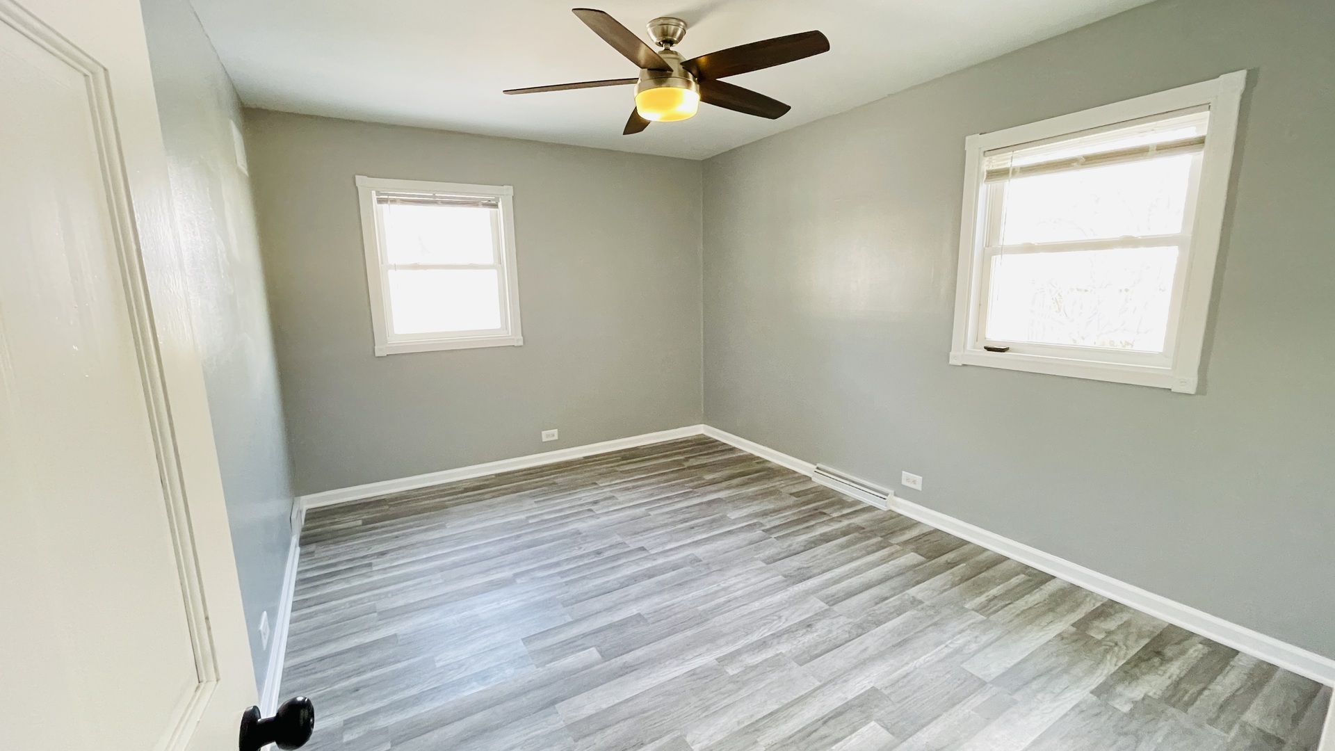 Undisclosed Address Addison, IL 60101 - Photo 10 of 26 an empty room with a window and wooden floor