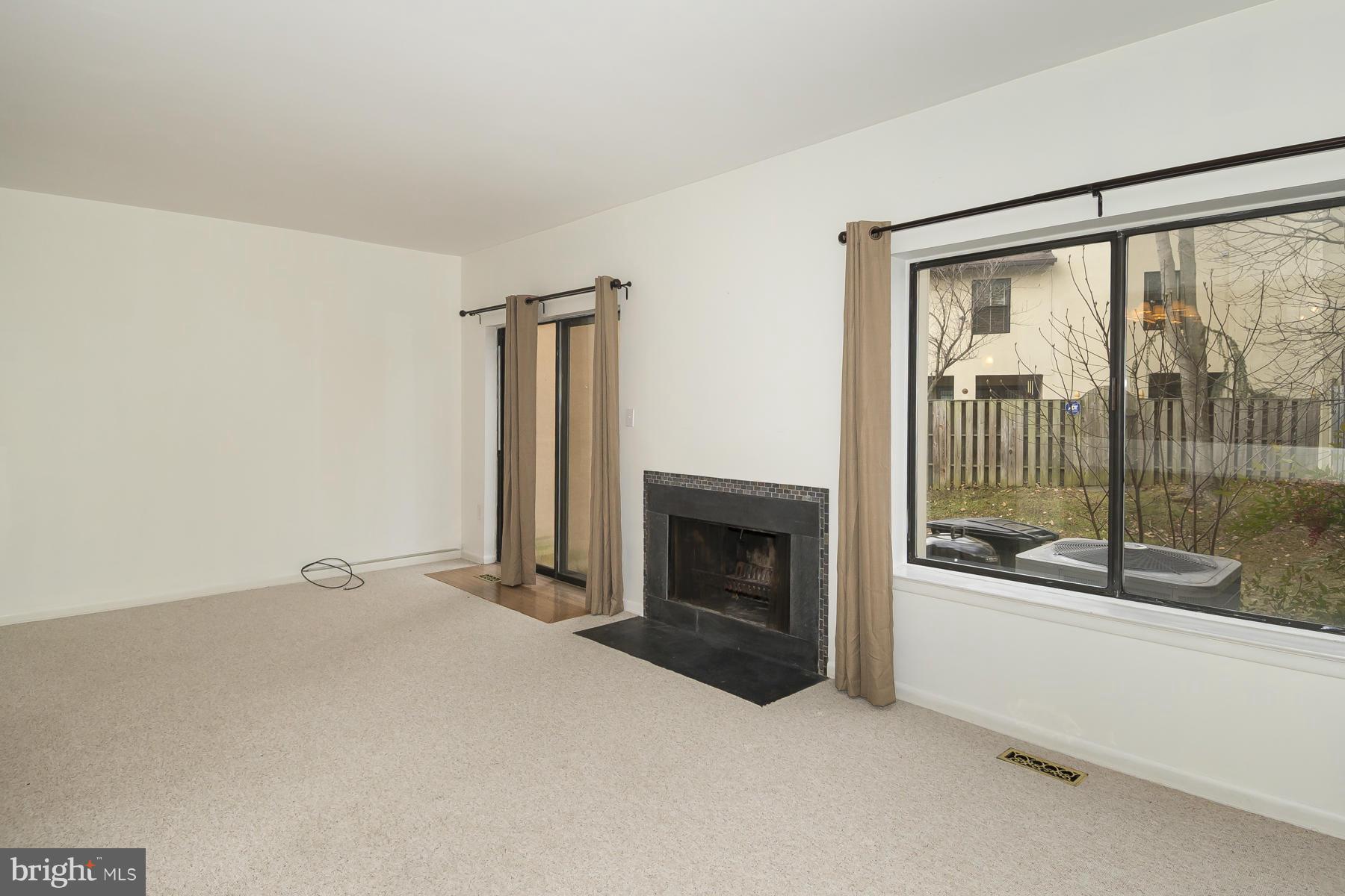 5611 Vantage Point Road Columbia, MD 21044 - Photo 10 of 28 Wood burning fireplace, large windows, walkout