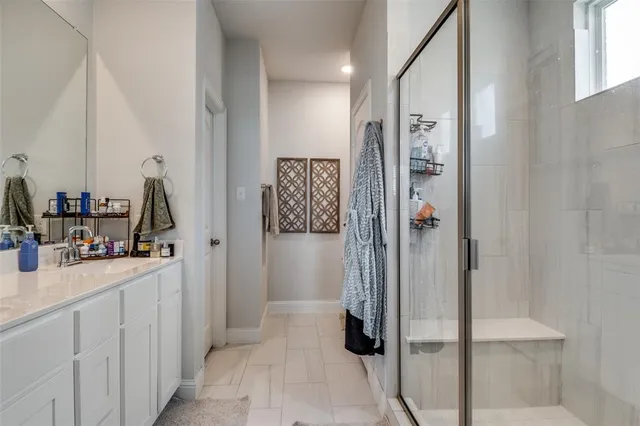 a view of a bathroom from a hallway