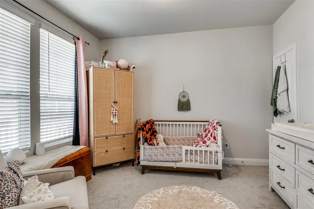 a bedroom with furniture and a window