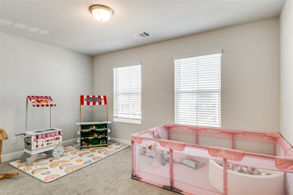 8413 Alba Lane Rowlett, TX 75089 - Photo 18 of 25 a bedroom with furniture and a window