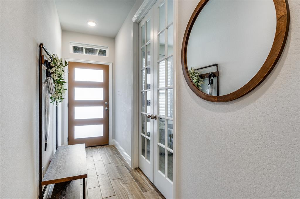 8413 Alba Lane Rowlett, TX 75089 - Photo 2 of 25 a view of a livingroom from a hallway