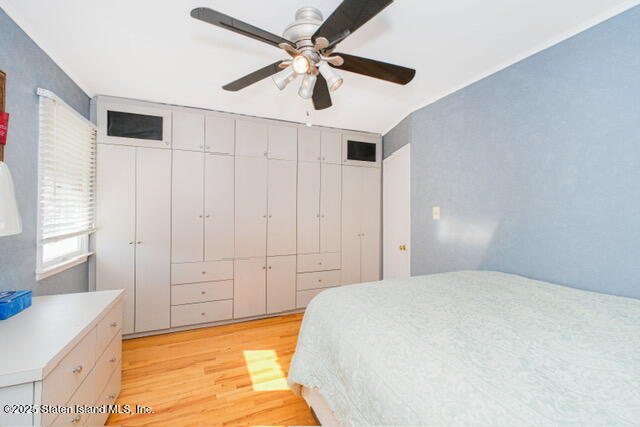 25 Berry Avenue West Staten Island, NY 10312 - Photo 19 of 24 a spacious bedroom with a bed and a ceiling fan