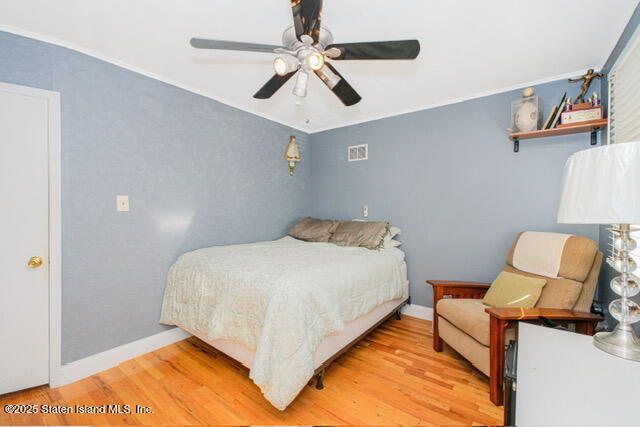 25 Berry Avenue West Staten Island, NY 10312 - Photo 20 of 24 a bed room with a bed and a chair
