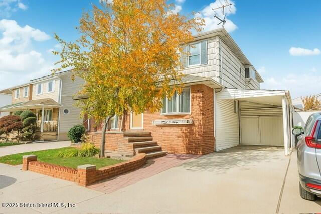 25 Berry Avenue West Staten Island, NY 10312 - Photo 2 of 24 a front view of a house with a garden and yard