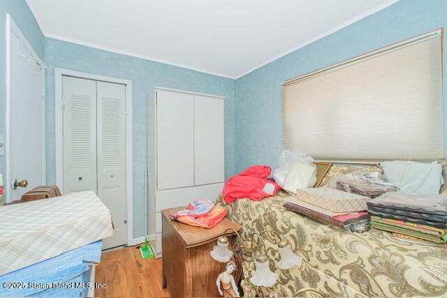 25 Berry Avenue West Staten Island, NY 10312 - Photo 21 of 24 a bed room with a bed and a chair