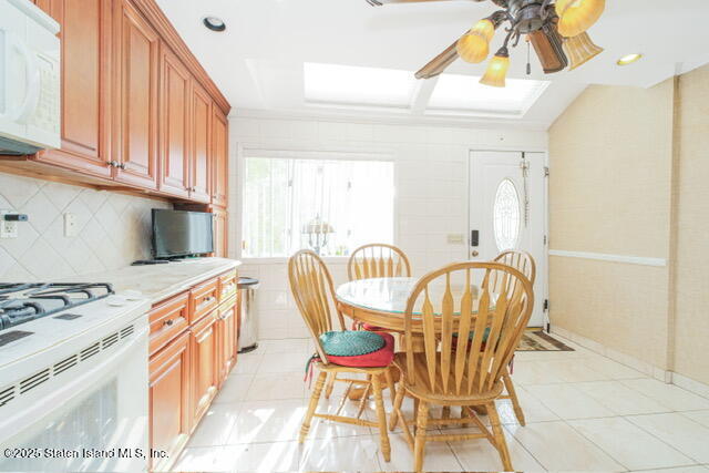 25 Berry Avenue West Staten Island, NY 10312 - Photo 7 of 24 a view of a dining room with furniture and a kitchen
