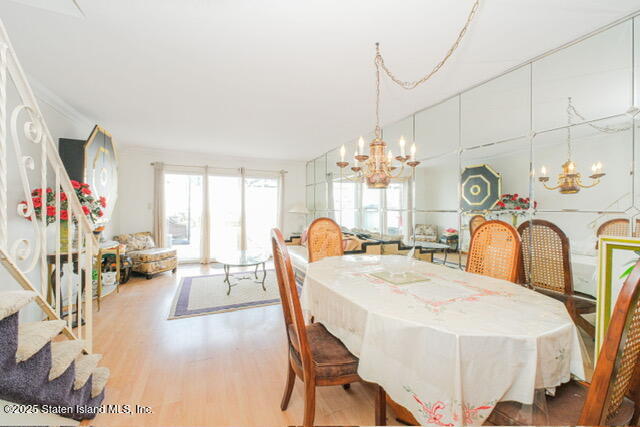 25 Berry Avenue West Staten Island, NY 10312 - Photo 9 of 24 a view of a dining room with furniture a chandelier and a window