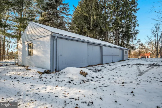 a view of a room with wooden floor and windows