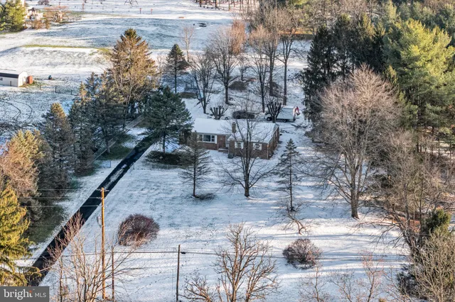 a view of a bathroom with a sink and a mirror