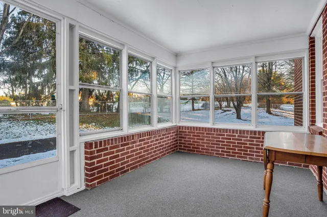 a view of livingroom with furniture and windows