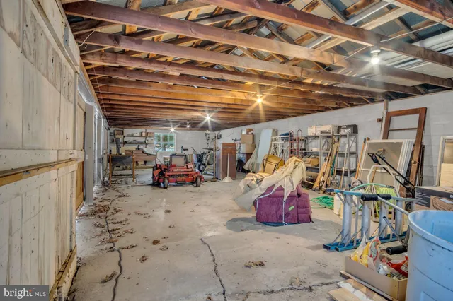 a view of dirt yard with a tree