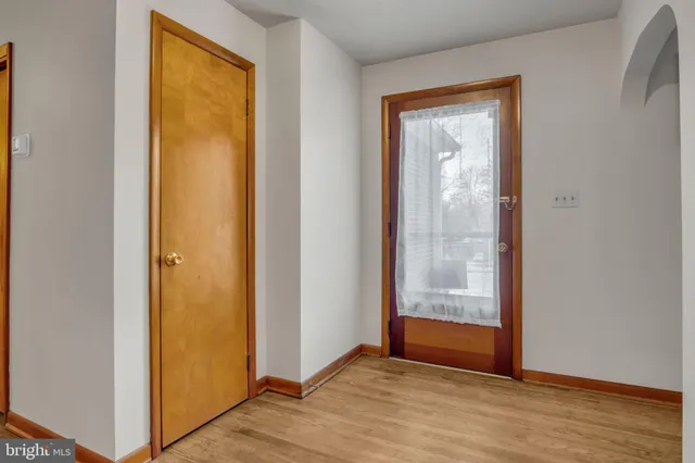 a view of room with furniture and wooden floor