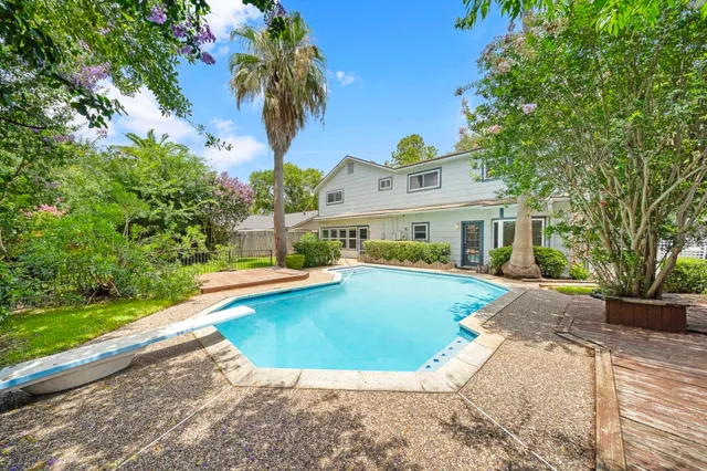 a view of a house with swimming pool