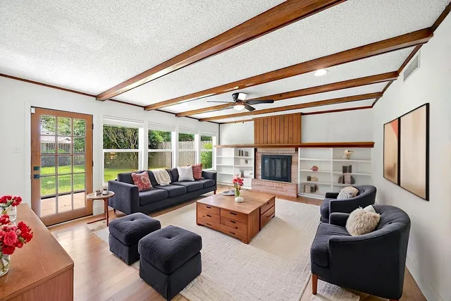 a kitchen with stainless steel appliances granite countertop a sink and a refrigerator