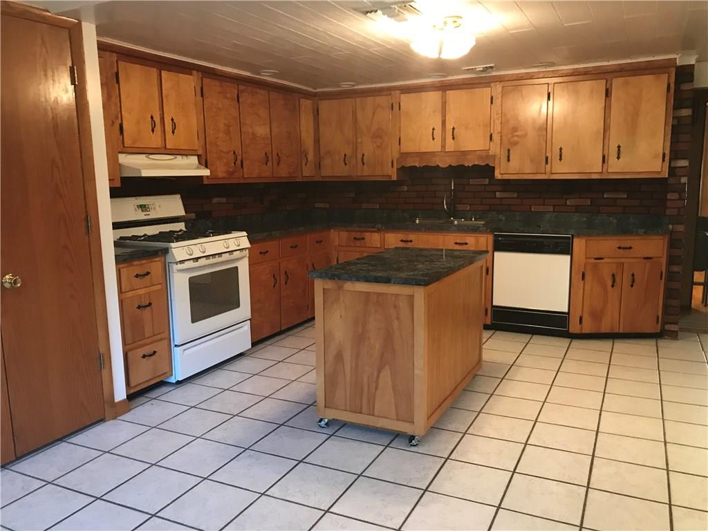 134 Atlantic Road New Derry, PA 15671 - Photo 5 of 9 Spacious Open Eat in Kitchen with Island and Plenty of Cupboards - All Appliances Stay
