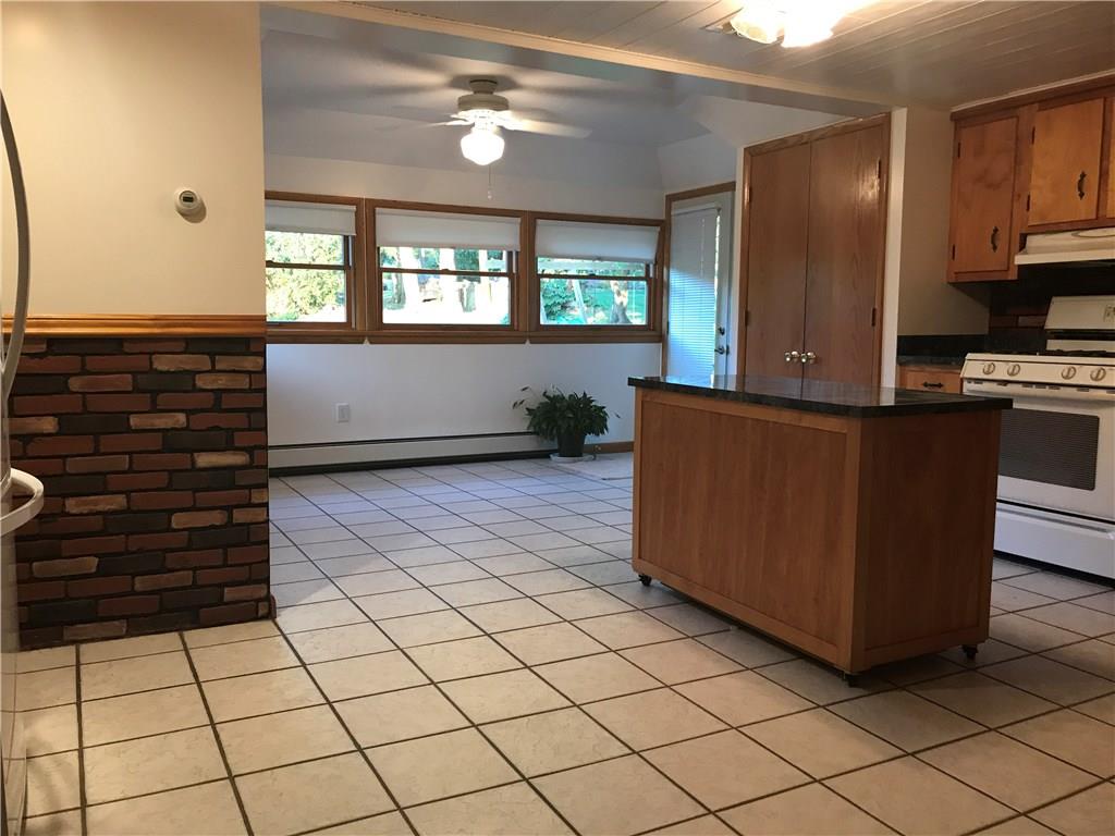 134 Atlantic Road New Derry, PA 15671 - Photo 6 of 9 Eat in Kitchen with Powder Room and exist to Back Porch Deck & Yard