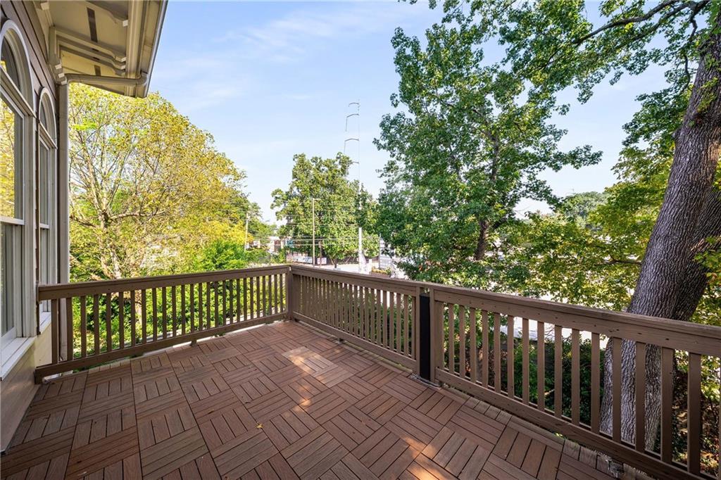 911 Monroe Circle Northeast Atlanta, GA 30308 - Photo 17 of 86 a view of a balcony with wooden floor
