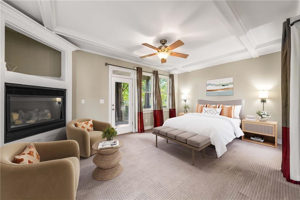 911 Monroe Circle Northeast Atlanta, GA 30308 - Photo 23 of 86 a spacious bedroom with a bed a couch and a fireplace