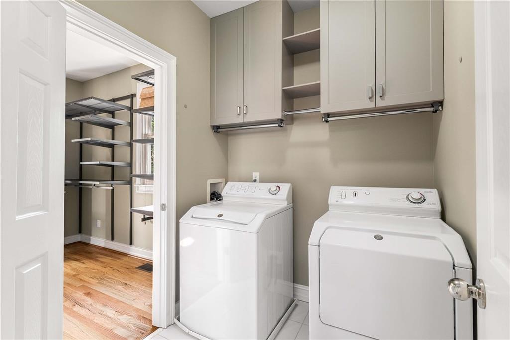 911 Monroe Circle Northeast Atlanta, GA 30308 - Photo 32 of 86 a view of storage and utility room with washer and dryer