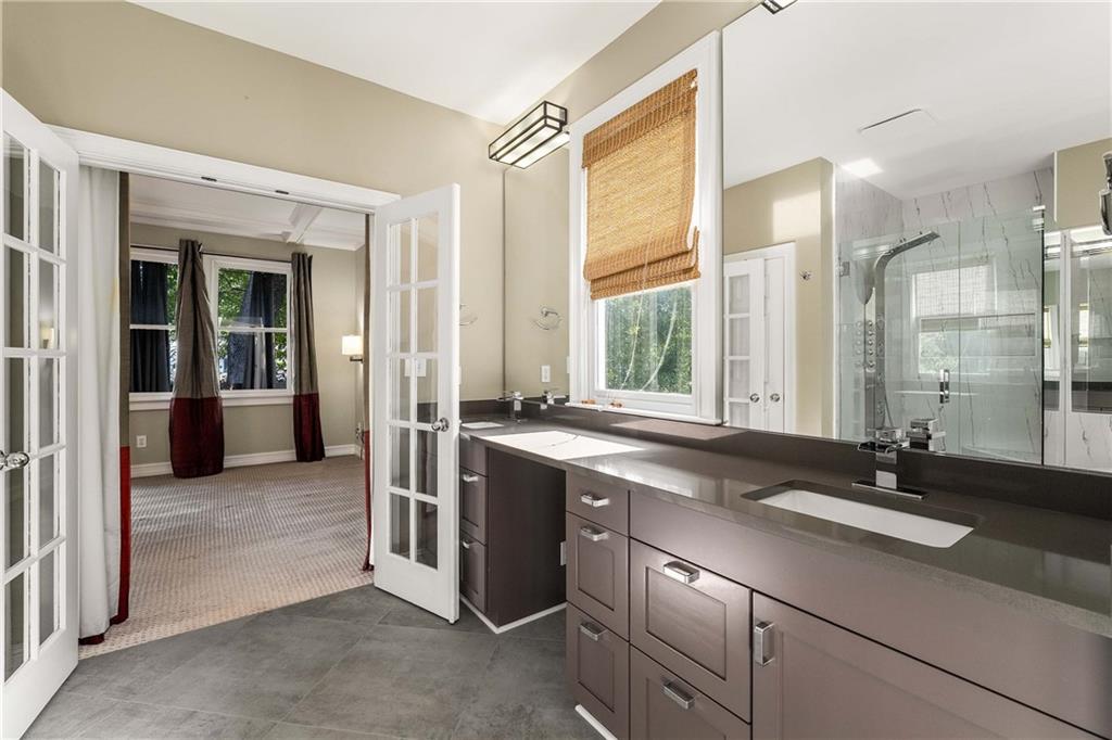 911 Monroe Circle Northeast Atlanta, GA 30308 - Photo 37 of 86 a view of a double sink and a large window in a room