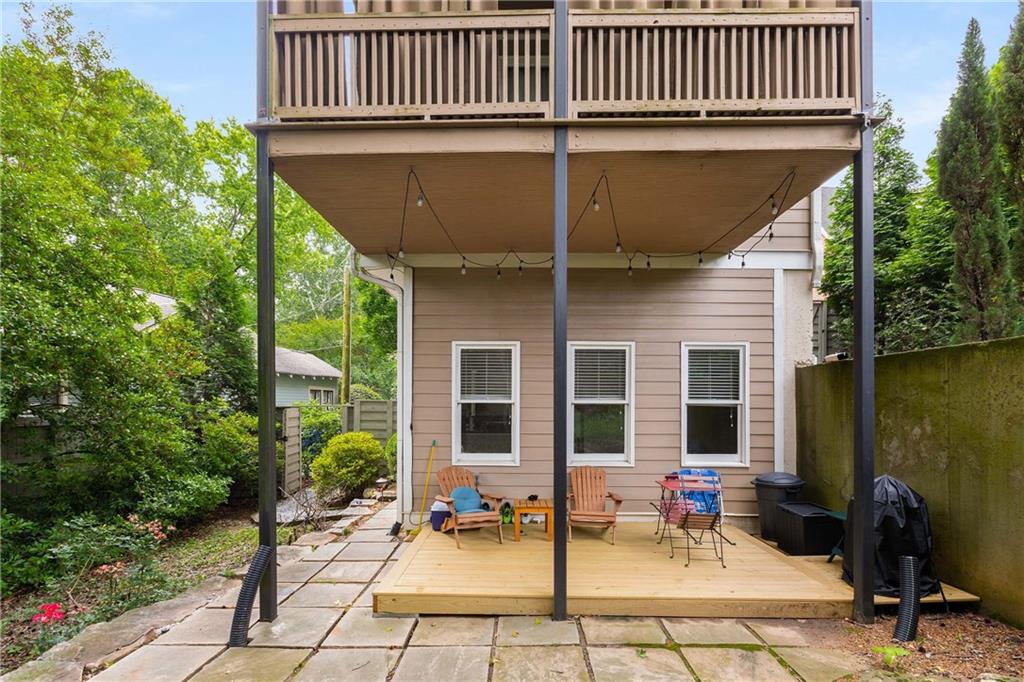 911 Monroe Circle Northeast Atlanta, GA 30308 - Photo 51 of 86 a chairs and table in front of a house