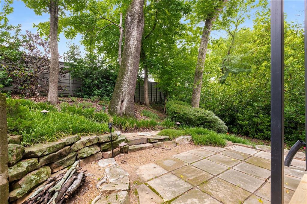 911 Monroe Circle Northeast Atlanta, GA 30308 - Photo 52 of 86 a view of backyard with a garden and trees