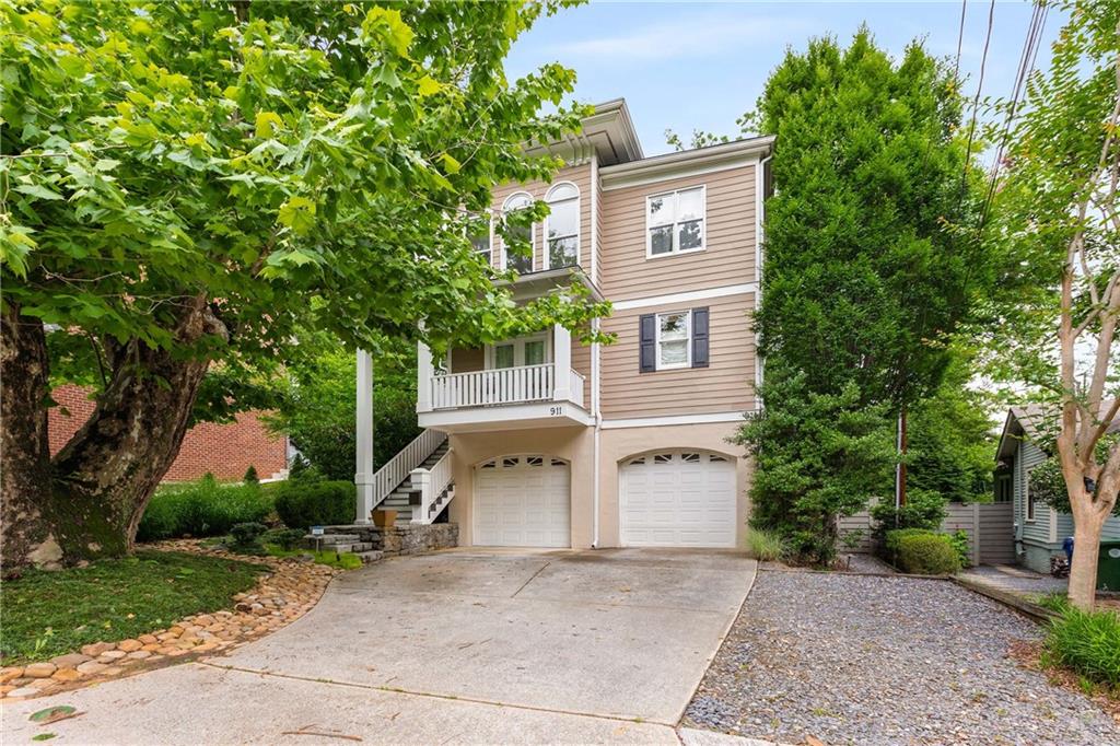 911 Monroe Circle Northeast Atlanta, GA 30308 - Photo 60 of 86 front view of house with a yard and trees