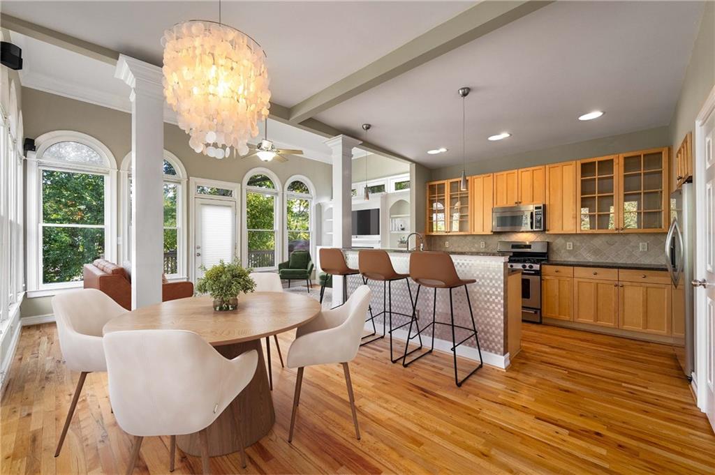 911 Monroe Circle Northeast Atlanta, GA 30308 - Photo 6 of 86 a view of a dining room with furniture window and wooden floor