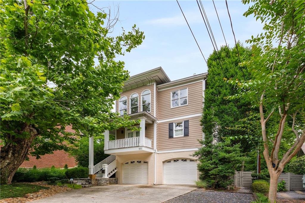 911 Monroe Circle Northeast Atlanta, GA 30308 - Photo 74 of 86 a front view of a house with a yard and tree s