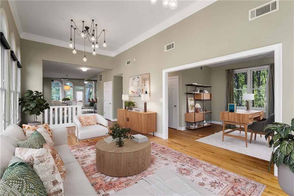 911 Monroe Circle Northeast Atlanta, GA 30308 - Photo 8 of 86 a living room with furniture and a chandelier
