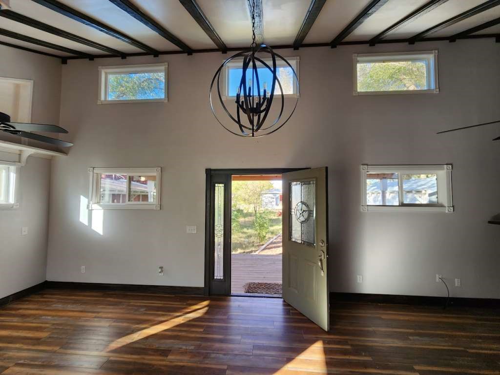108 East 9th Street Channing, TX 79018 - Photo 3 of 16 a view of an entryway with wooden floor