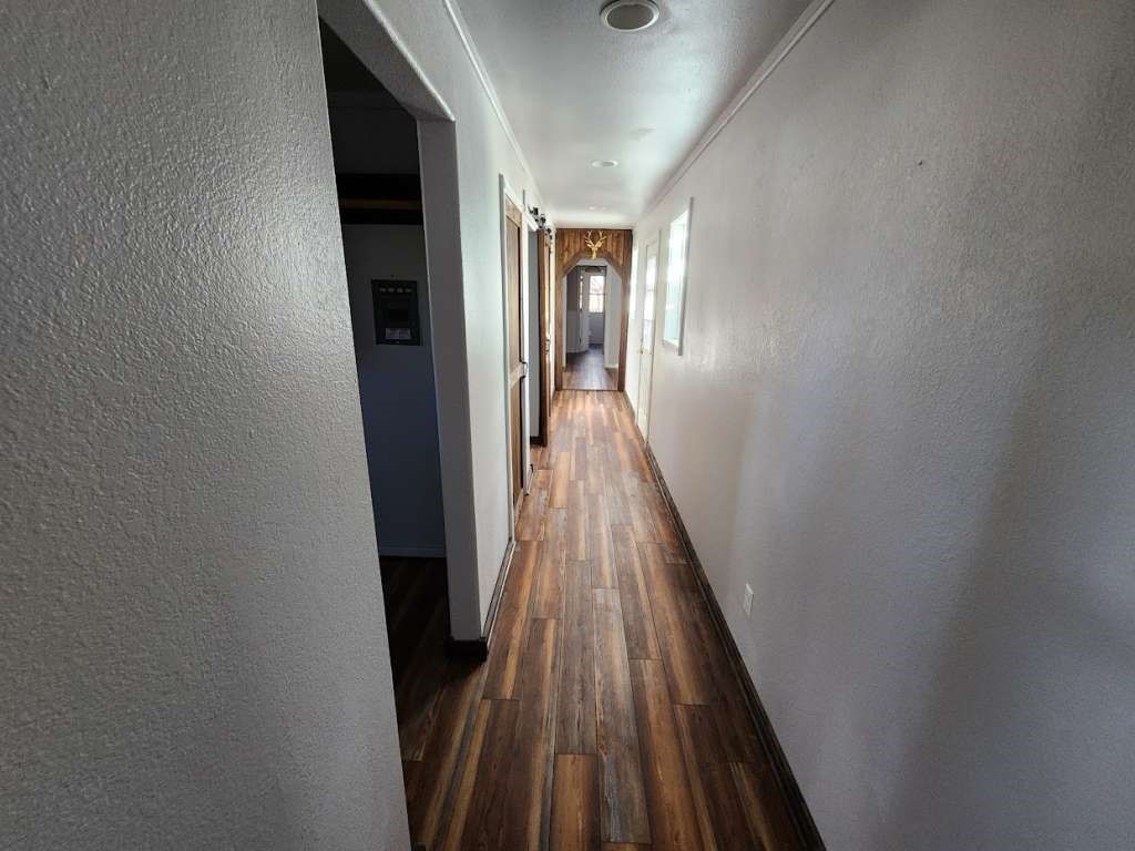108 East 9th Street Channing, TX 79018 - Photo 5 of 16 a view of gallery with wooden floor