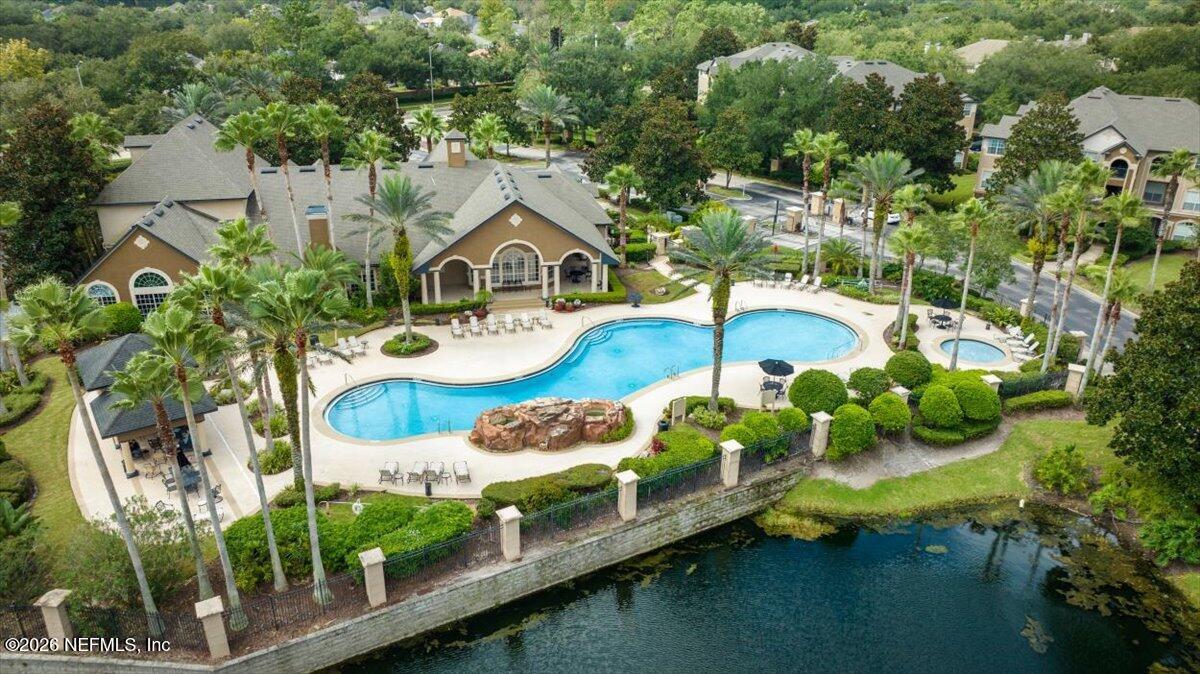 10961 Burnt Mill Road, Unit 1017 Jacksonville, FL 32256 - Photo 24 of 26 a aerial view of a house with swimming pool and garden