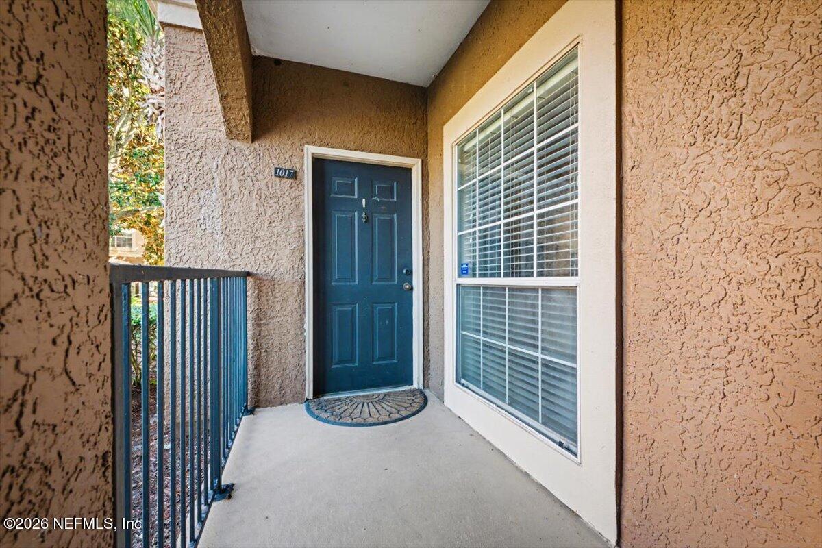 10961 Burnt Mill Road, Unit 1017 Jacksonville, FL 32256 - Photo 3 of 26 a view of a door and wooden floor