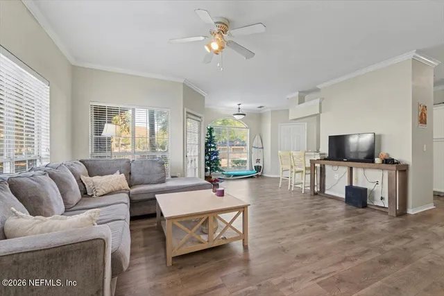 a living room with furniture and a flat screen tv