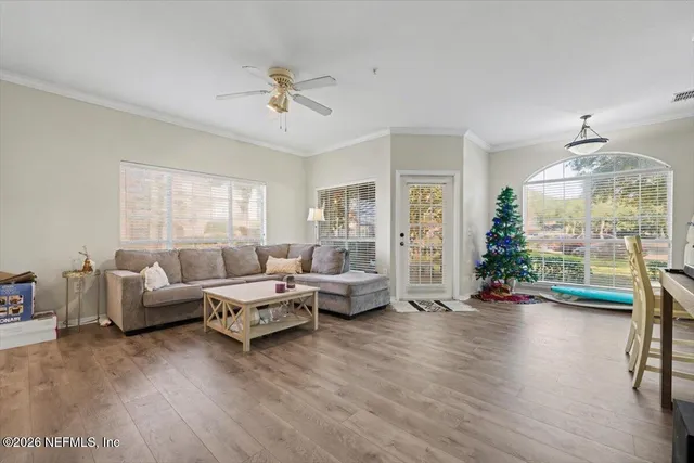 a living room with furniture and a large window