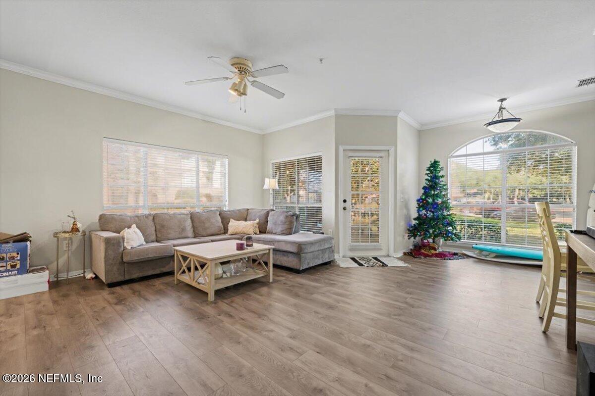 10961 Burnt Mill Road, Unit 1017 Jacksonville, FL 32256 - Photo 5 of 26 a living room with furniture and a large window