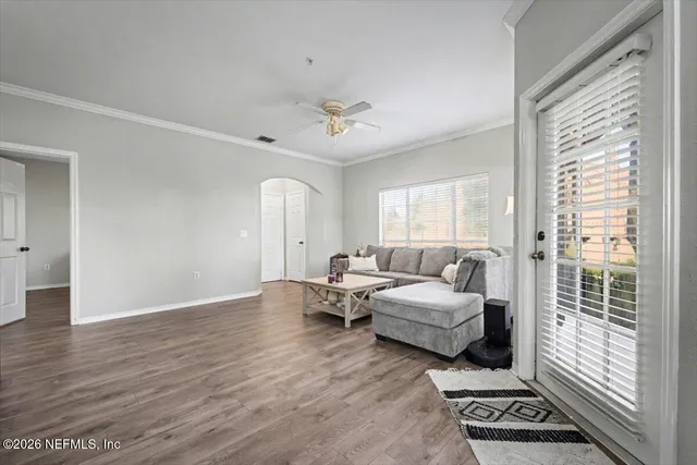 a living room with furniture and a window