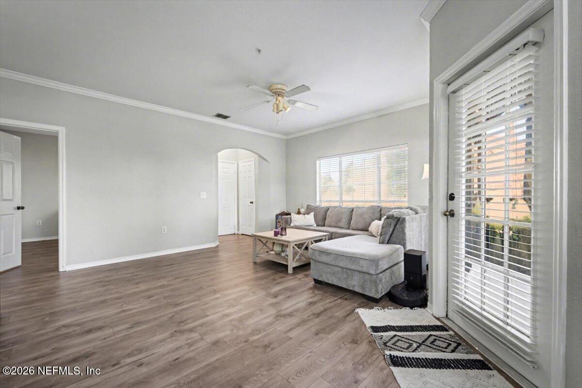 10961 Burnt Mill Road, Unit 1017 Jacksonville, FL 32256 - Photo 6 of 26 a living room with furniture and a window